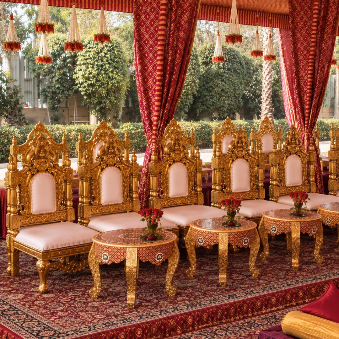 Royal crimson red Indian wedding mandap with velvet seating and golden embroidery